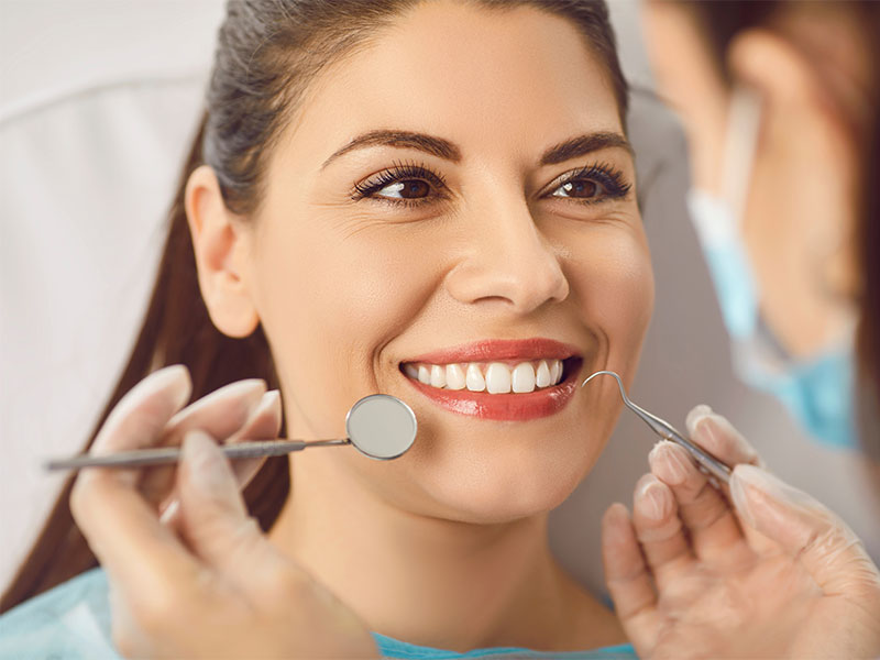 woman smiling making the OK sign